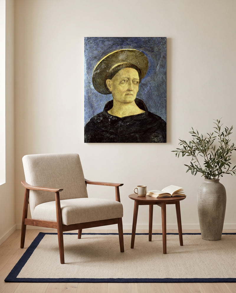 Head of a Beardless Saint by Domenico Veneziano as a stretched canvas above a linen lounge chair in a reading corner