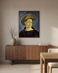 Head of a Beardless Saint by Domenico Veneziano in a black frame above a walnut sideboard in a dining room