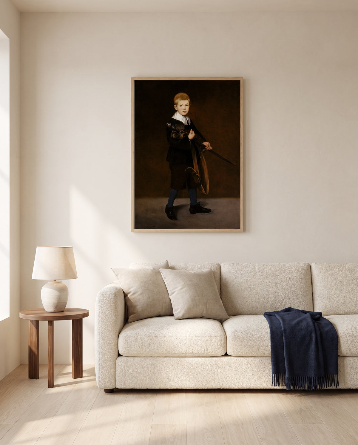 Boy Carrying a Sword by Édouard Manet framed in natural oak above a cream sofa in a warm living room