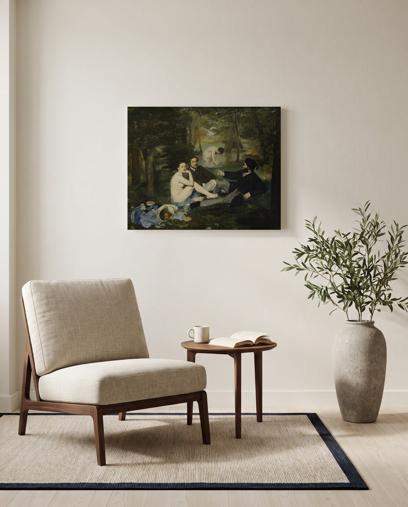 Le Déjeuner sur l’herbe by Édouard Manet as a stretched canvas above a linen lounge chair in a reading corner