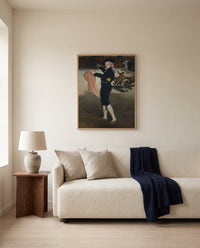 Mlle V. as an Espada by Édouard Manet framed in natural oak above a cream sofa in a warm living room