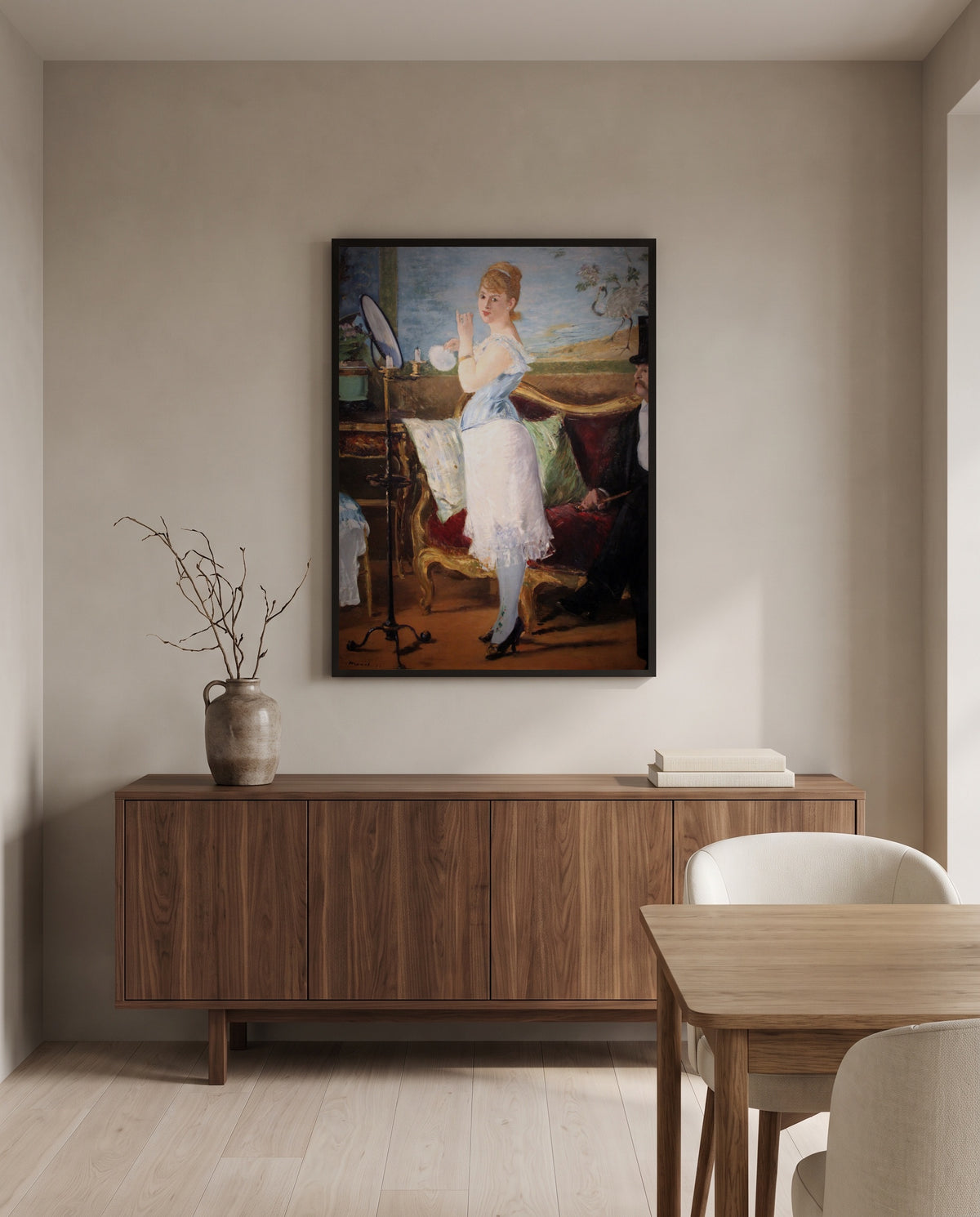 Nana by Édouard Manet in a black frame above a walnut sideboard in a dining room