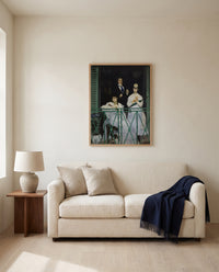 The Balcony by Édouard Manet framed in natural oak above a cream sofa in a warm living room