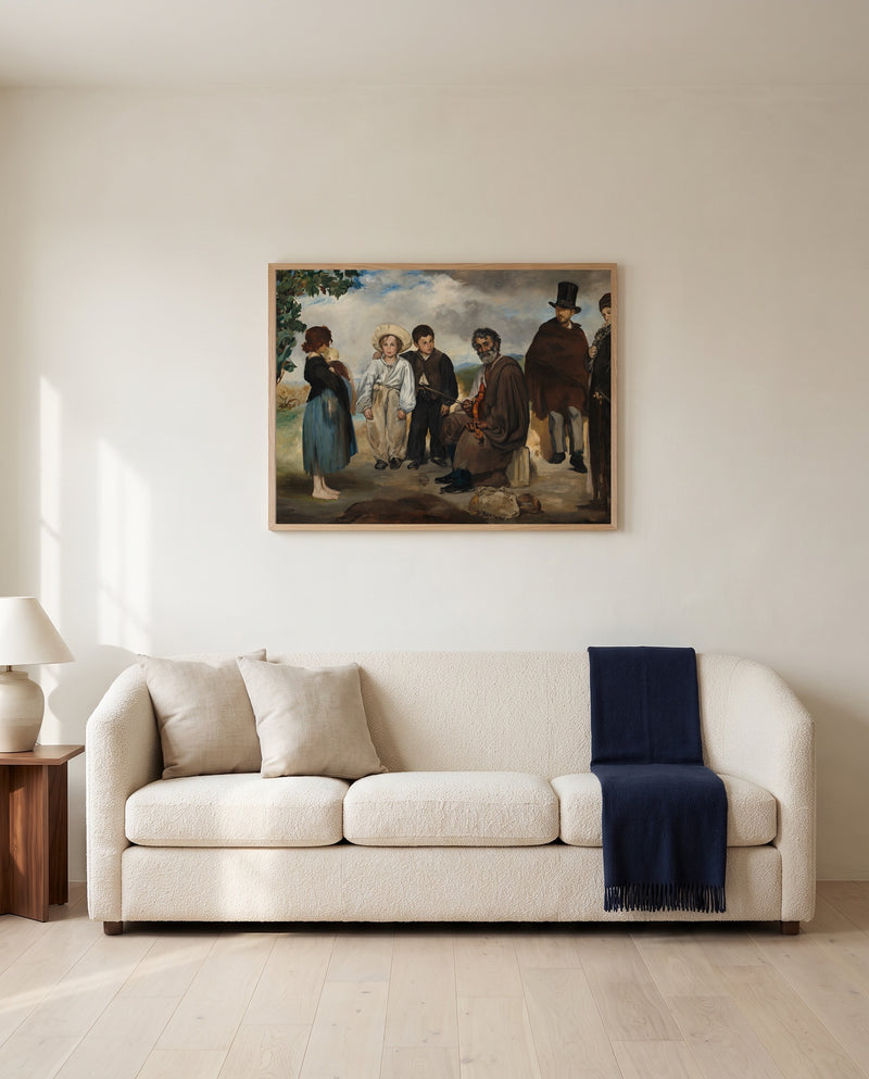The Old Musician by Édouard Manet framed in natural oak above a cream sofa in a warm living room