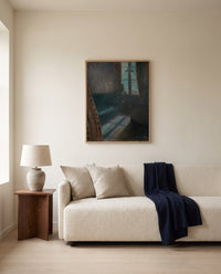 Night in Saint-Cloud by Edvard Munch framed in natural oak above a cream sofa in a warm living room