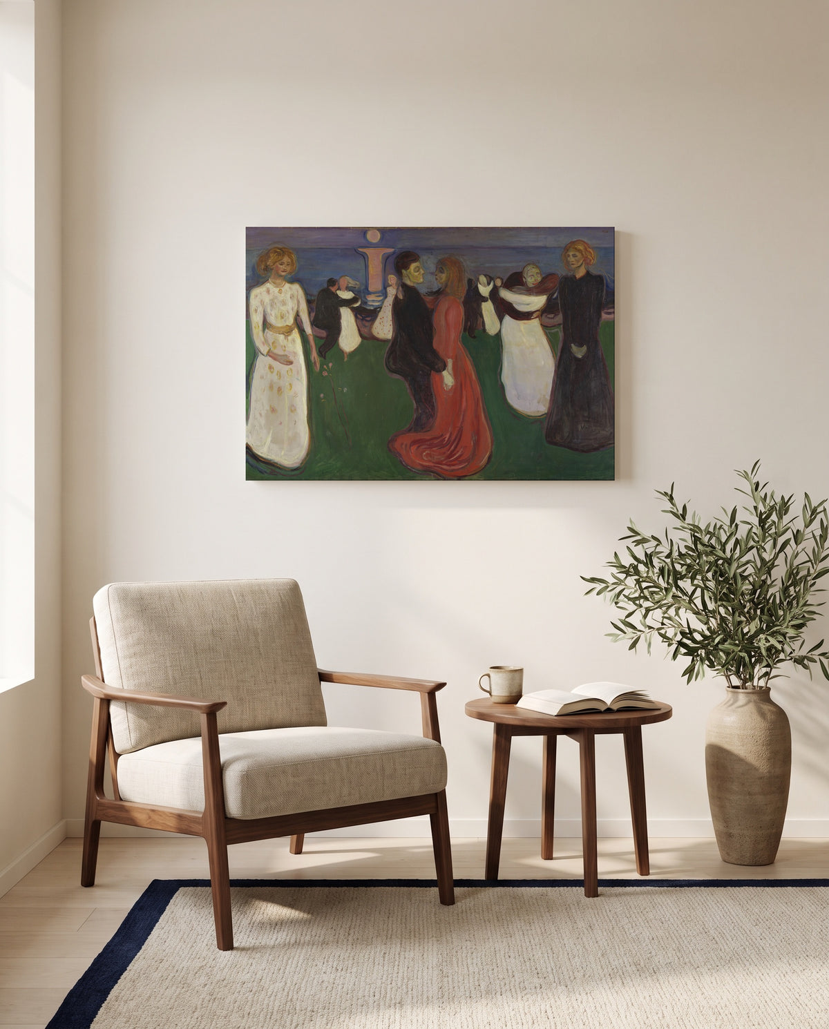 The Dance of Life by Edvard Munch as a stretched canvas above a linen lounge chair in a reading corner