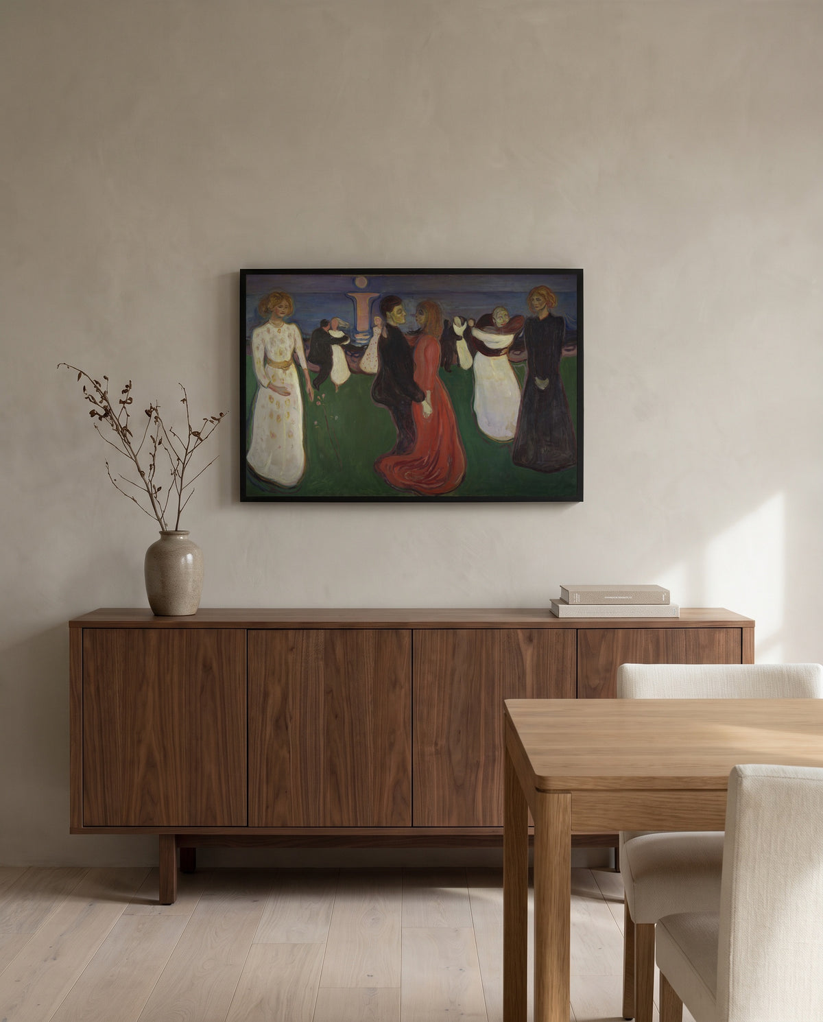 The Dance of Life by Edvard Munch in a black frame above a walnut sideboard in a dining room
