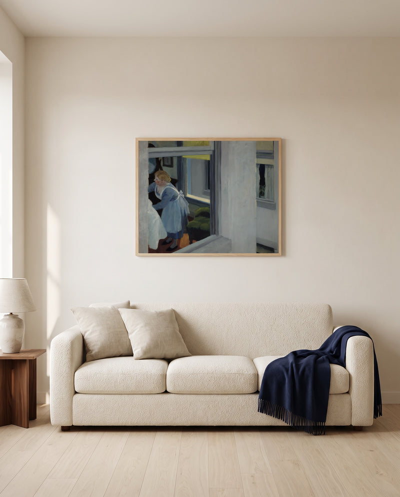 Apartment Houses by Edward Hopper framed in natural oak above a cream sofa in a warm living room