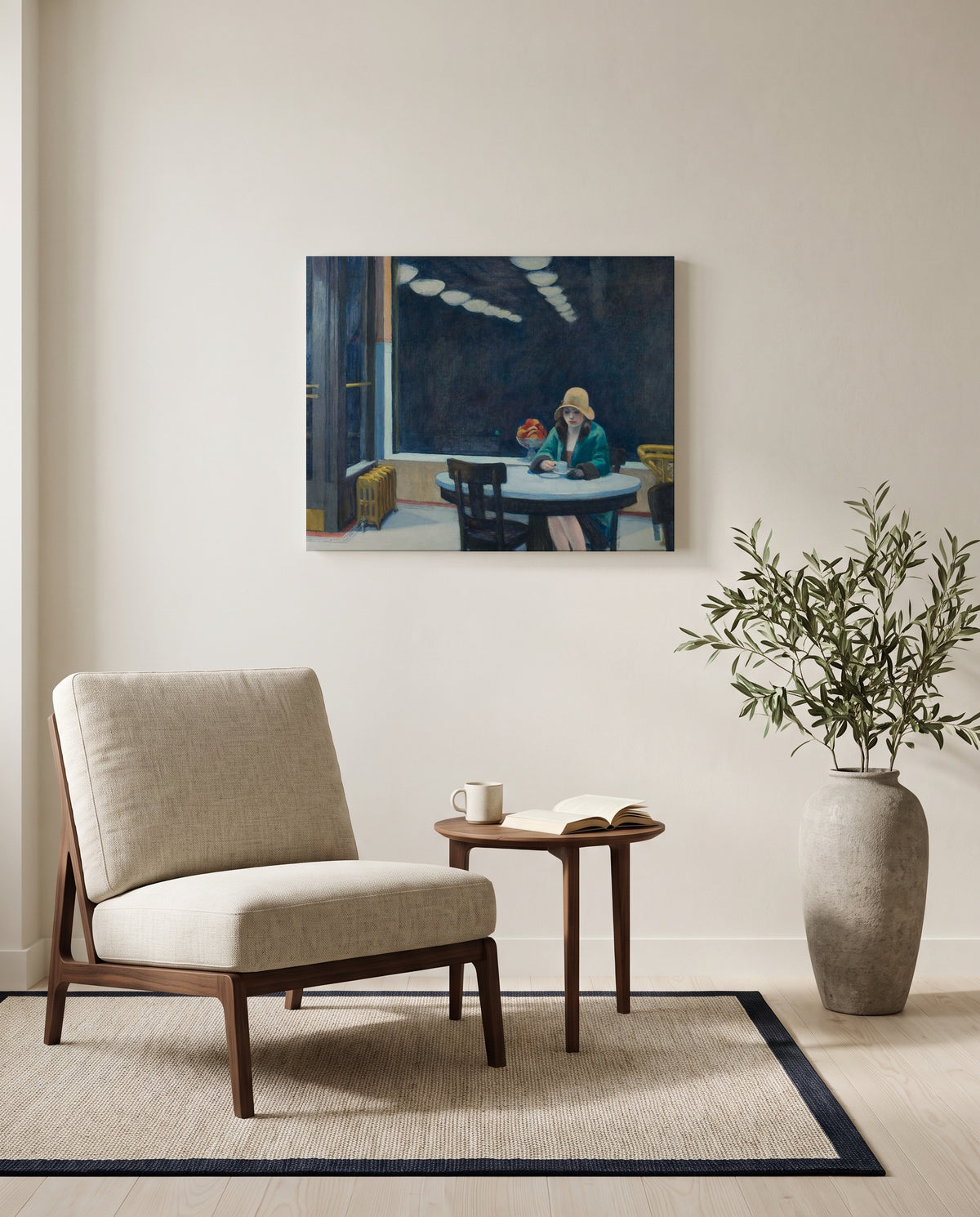 Automat by Edward Hopper as a stretched canvas above a linen lounge chair in a reading corner