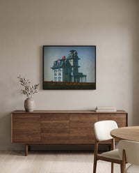 House by the Railroad by Edward Hopper in a black frame above a walnut sideboard in a dining room