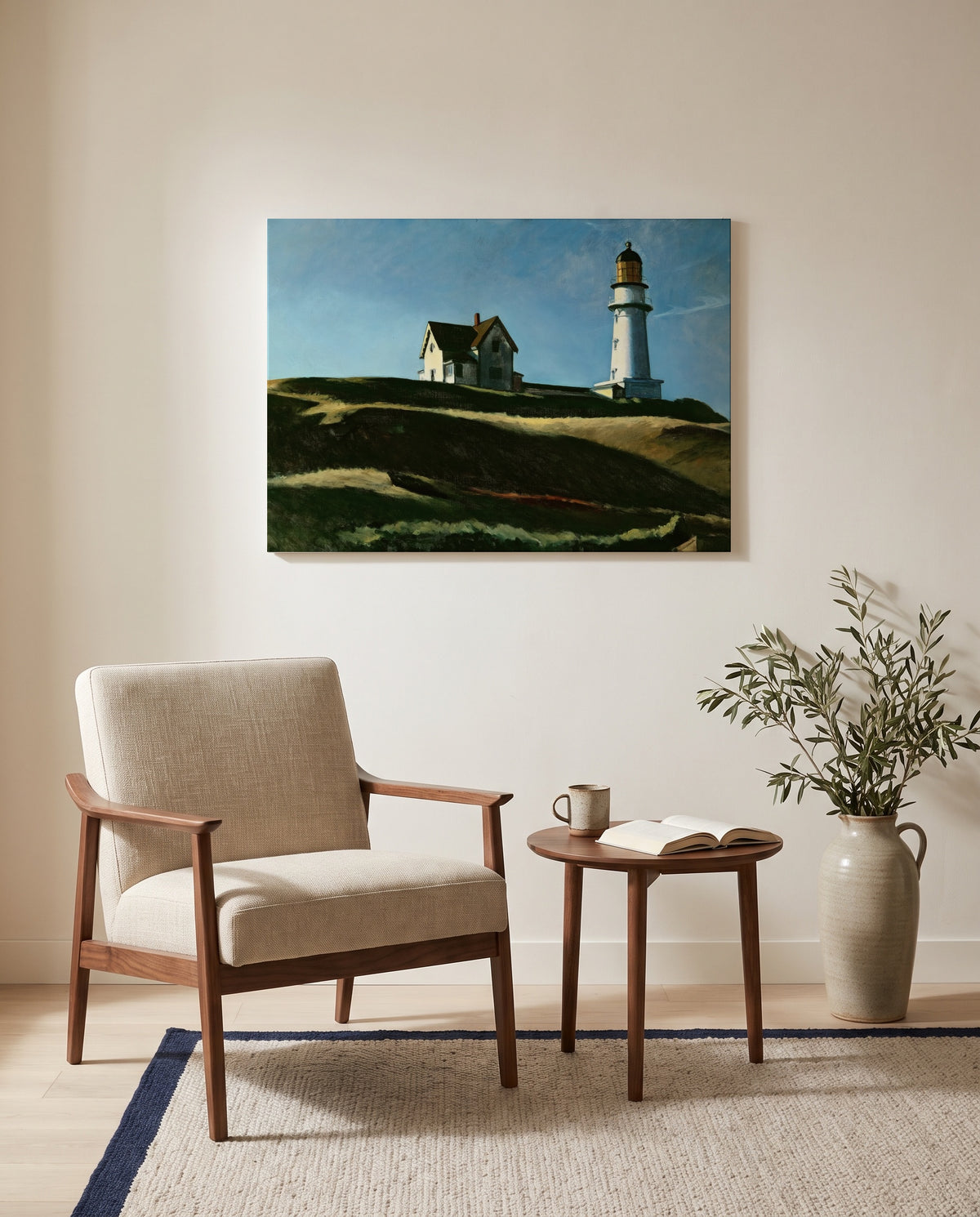Lighthouse Hill by Edward Hopper as a stretched canvas above a linen lounge chair in a reading corner