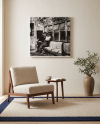 Night on the El Train by Edward Hopper as a stretched canvas above a linen lounge chair in a reading corner