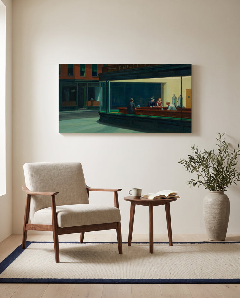 Nighthawks by Edward Hopper as a stretched canvas above a linen lounge chair in a reading corner