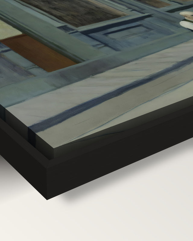 Sunday framed canvas, corner close-up: the canvas in a slim black floating frame, its painted edge in the shadow gap
