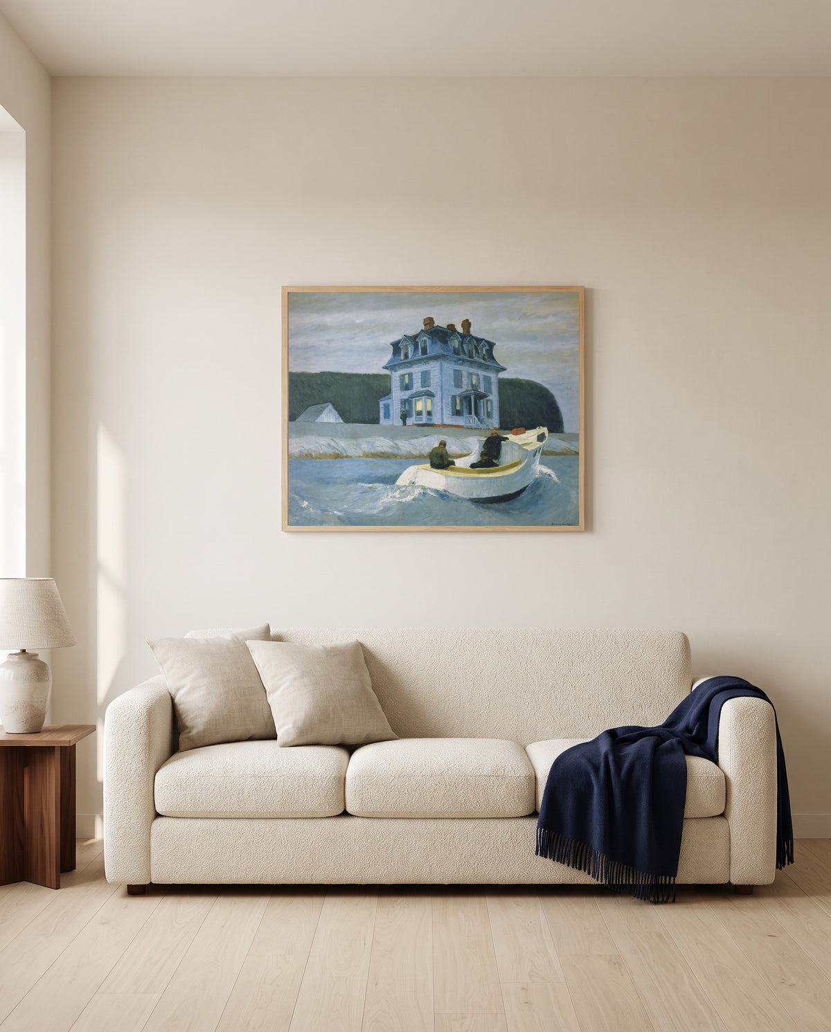 The Bootleggers by Edward Hopper framed in natural oak above a cream sofa in a warm living room