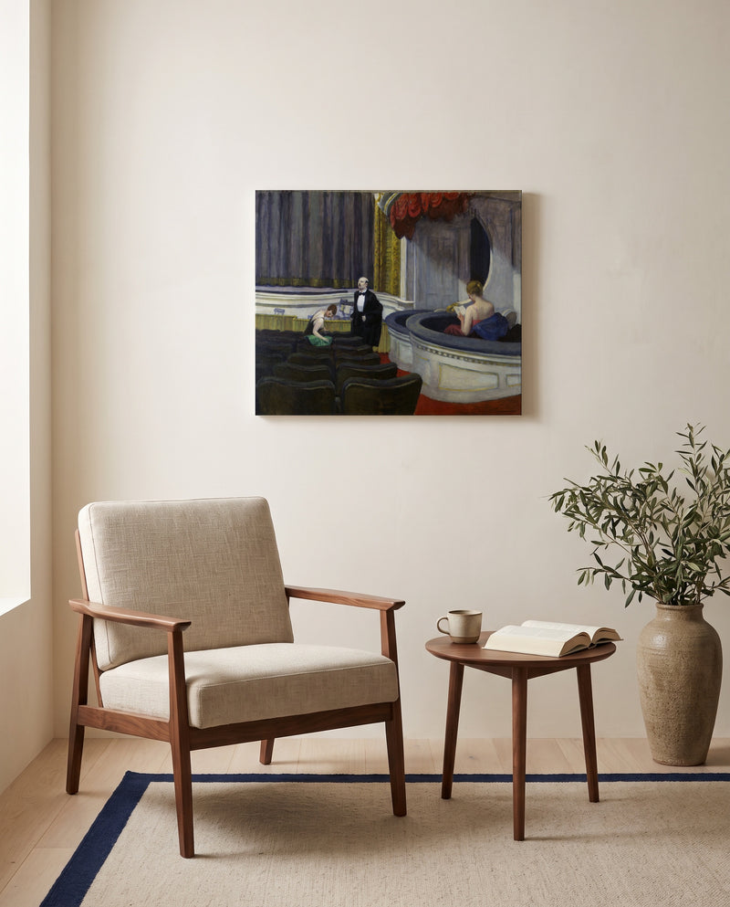 Two on the Aisle by Edward Hopper as a stretched canvas above a linen lounge chair in a reading corner