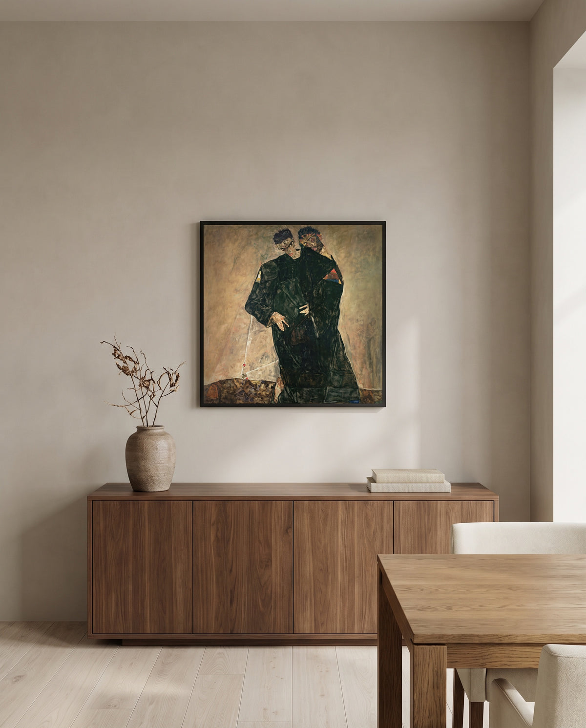 Hermits by Egon Schiele in a black frame above a walnut sideboard in a dining room