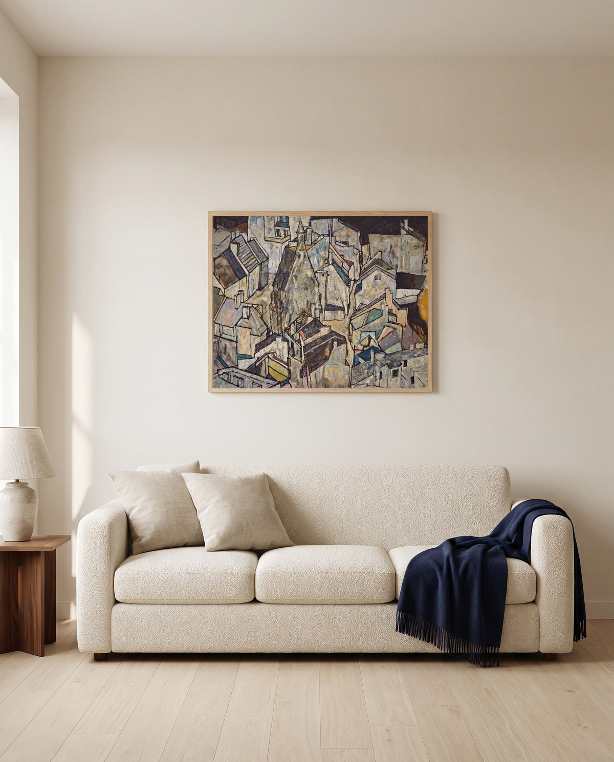 Mödling II by Egon Schiele framed in natural oak above a cream sofa in a warm living room