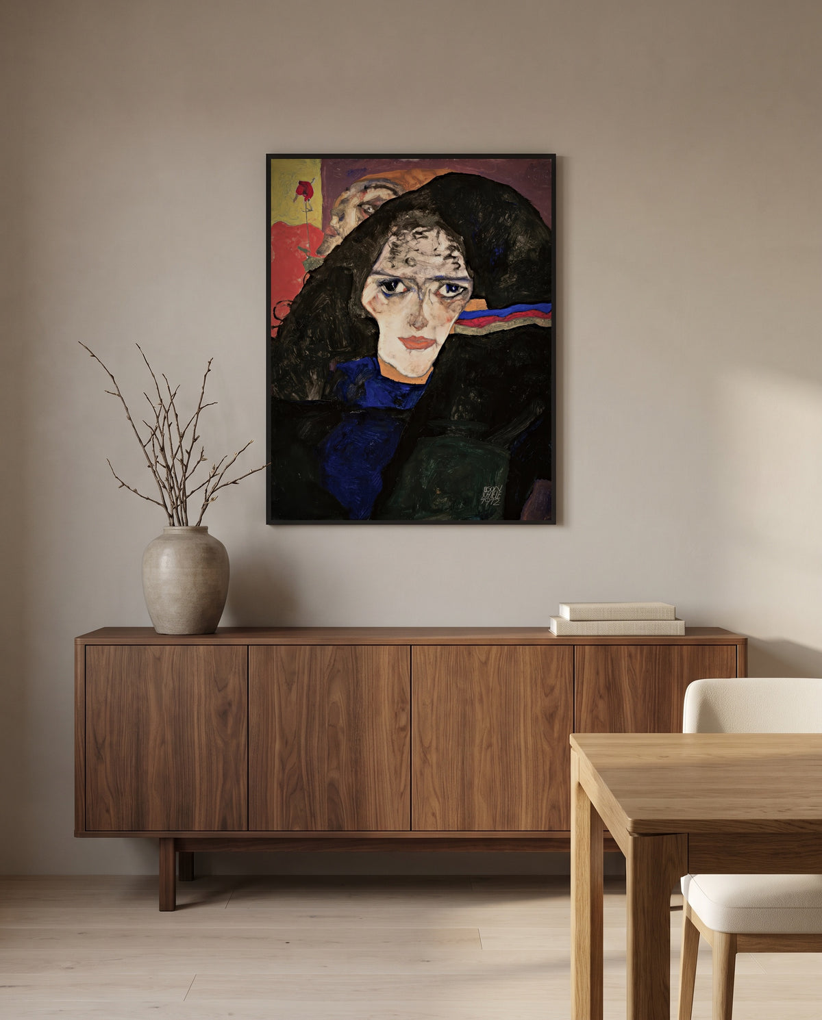 Mourning Woman by Egon Schiele in a black frame above a walnut sideboard in a dining room
