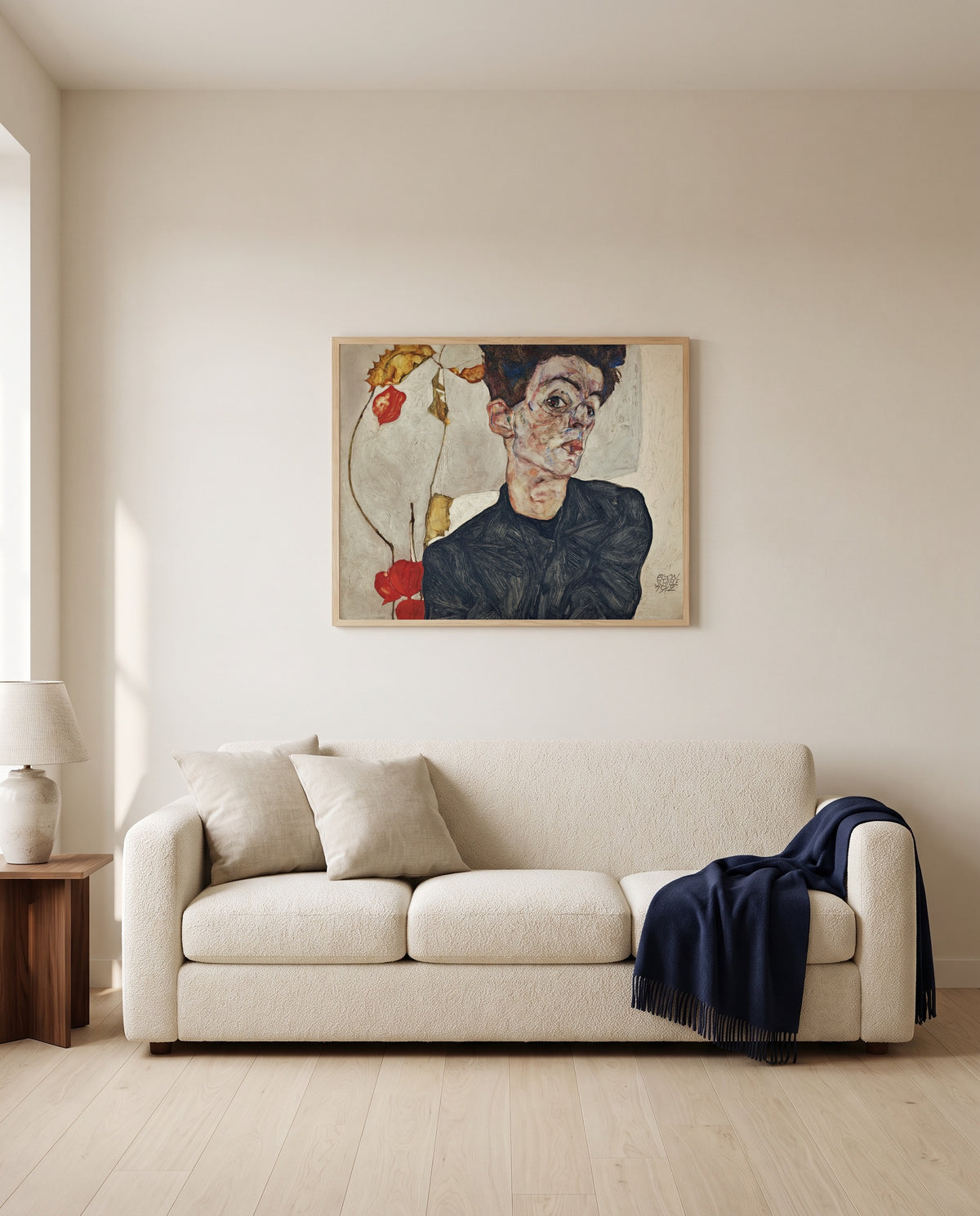 Self-Portrait with Physalis by Egon Schiele framed in natural oak above a cream sofa in a warm living room