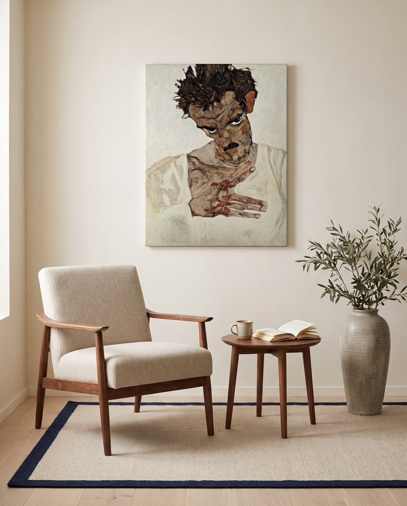 Self-Portrait, Lowered Head by Egon Schiele as a stretched canvas above a linen lounge chair in a reading corner