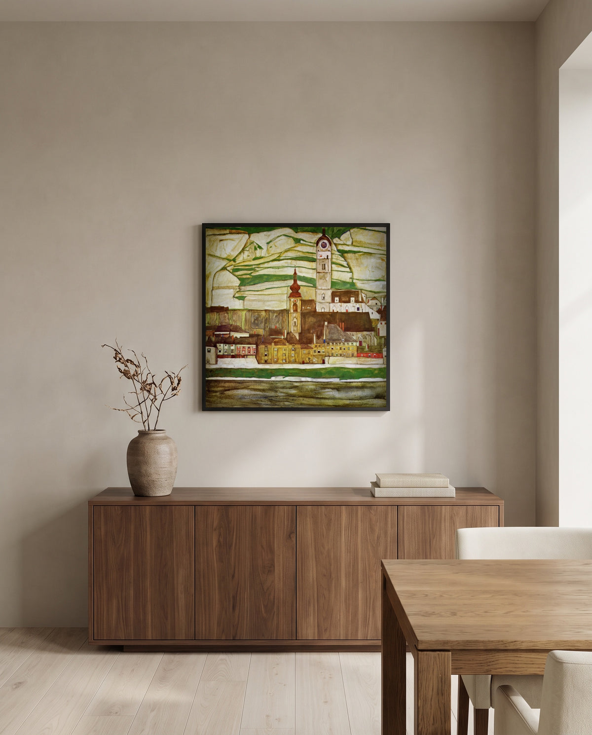 Stein on the Danube by Egon Schiele in a black frame above a walnut sideboard in a dining room