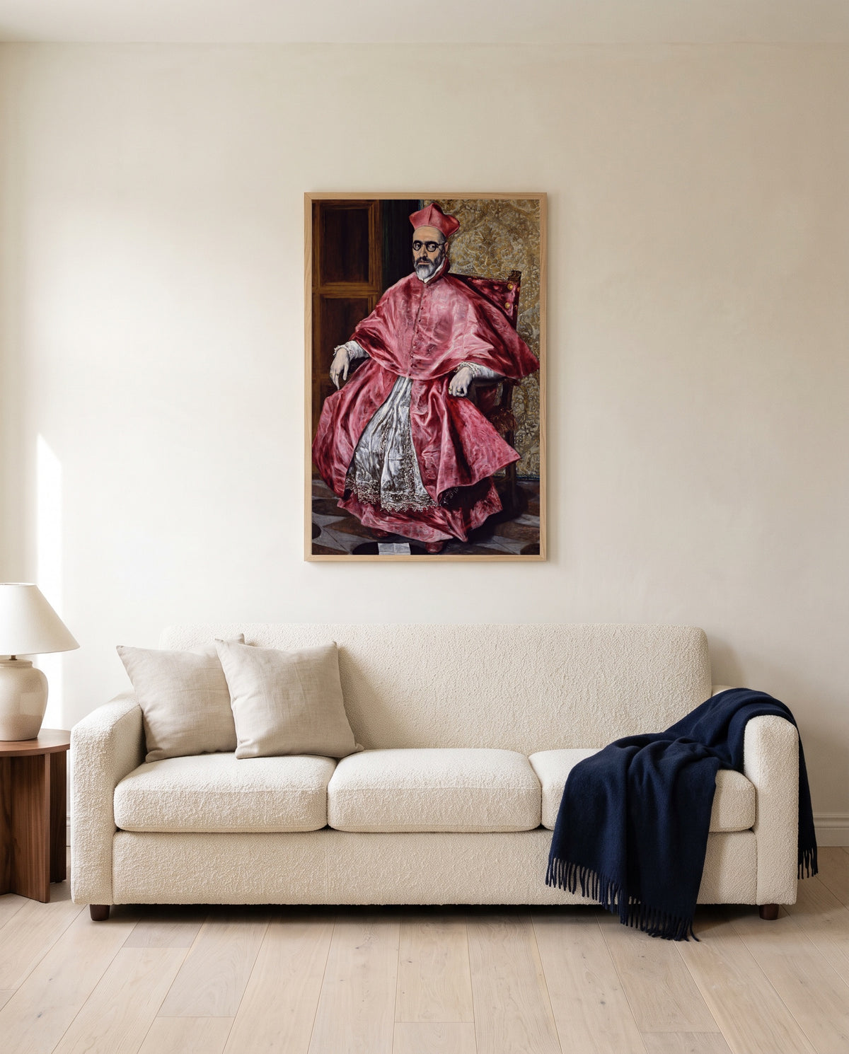 Cardinal Niño de Guevara by El Greco framed in natural oak above a cream sofa in a warm living room