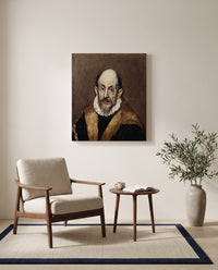 Portrait of an Old Man by El Greco as a stretched canvas above a linen lounge chair in a reading corner