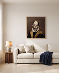 Portrait of an Old Man by El Greco framed in natural oak above a cream sofa in a warm living room