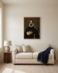 Nobleman, Hand on Chest by El Greco framed in natural oak above a cream sofa in a warm living room