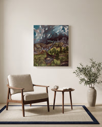 View of Toledo by El Greco as a stretched canvas above a linen lounge chair in a reading corner