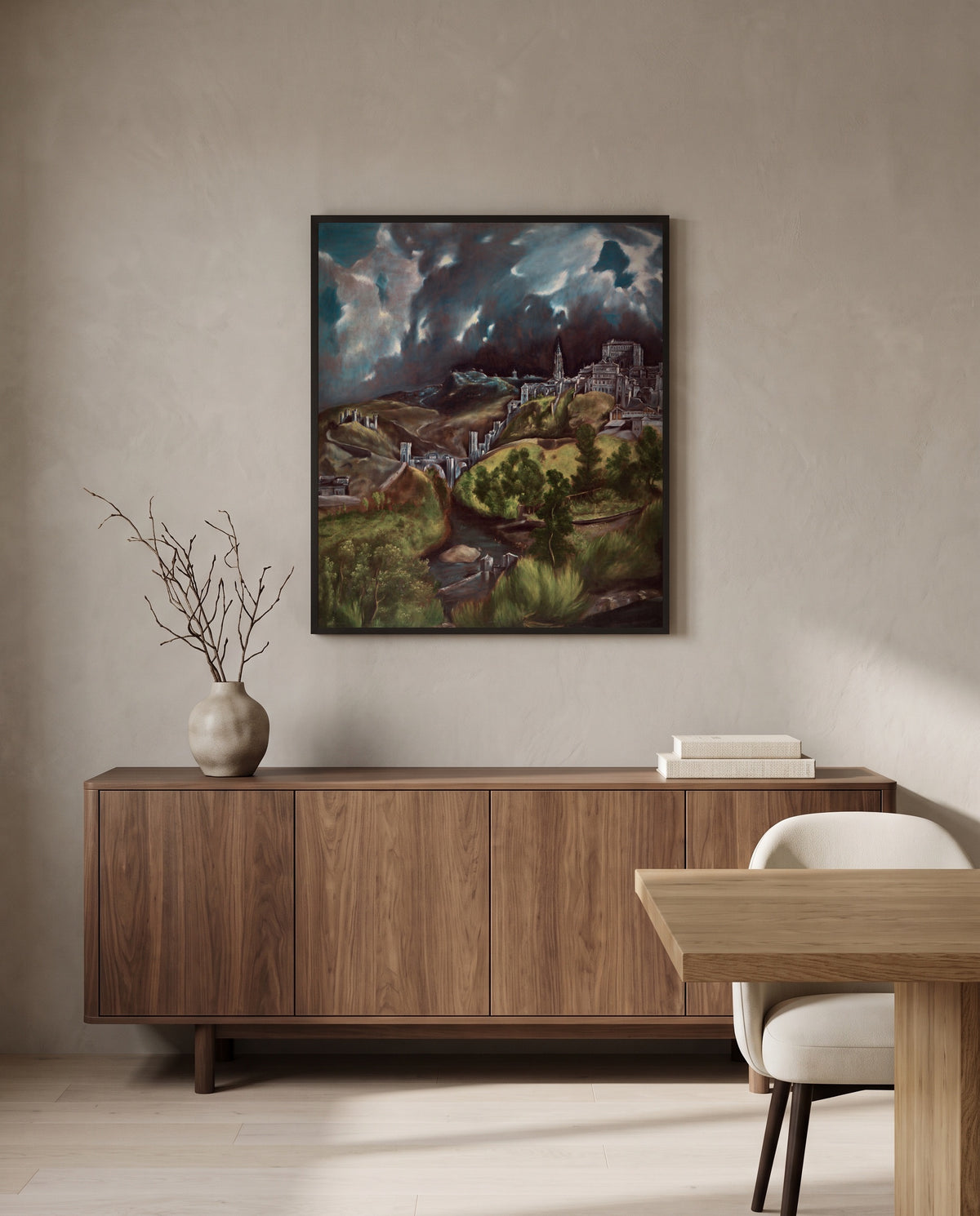 View of Toledo by El Greco in a black frame above a walnut sideboard in a dining room