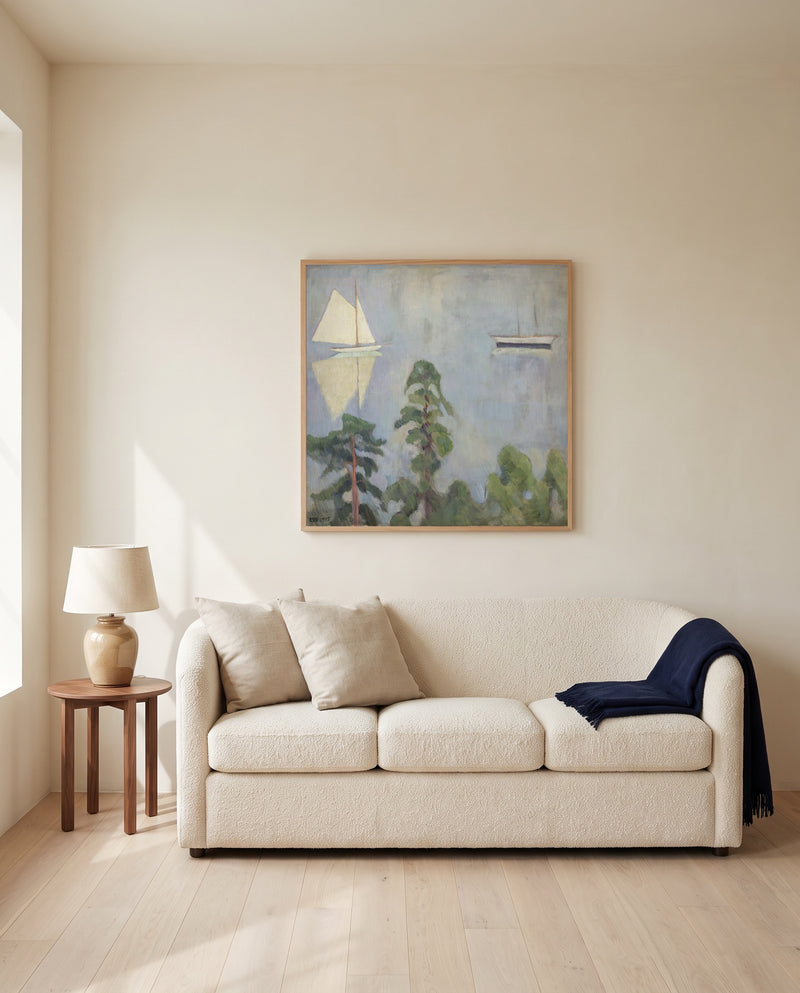Mirroring by Erik Werenskiold framed in natural oak above a cream sofa in a warm living room