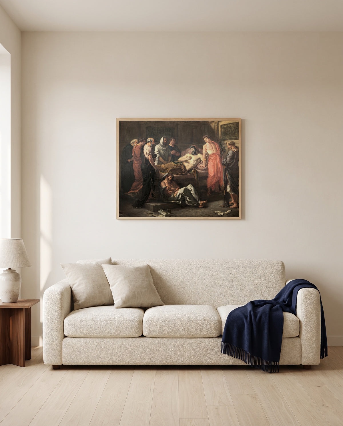 Last Words of Marcus Aurelius by Eugène Delacroix framed in natural oak above a cream sofa in a warm living room