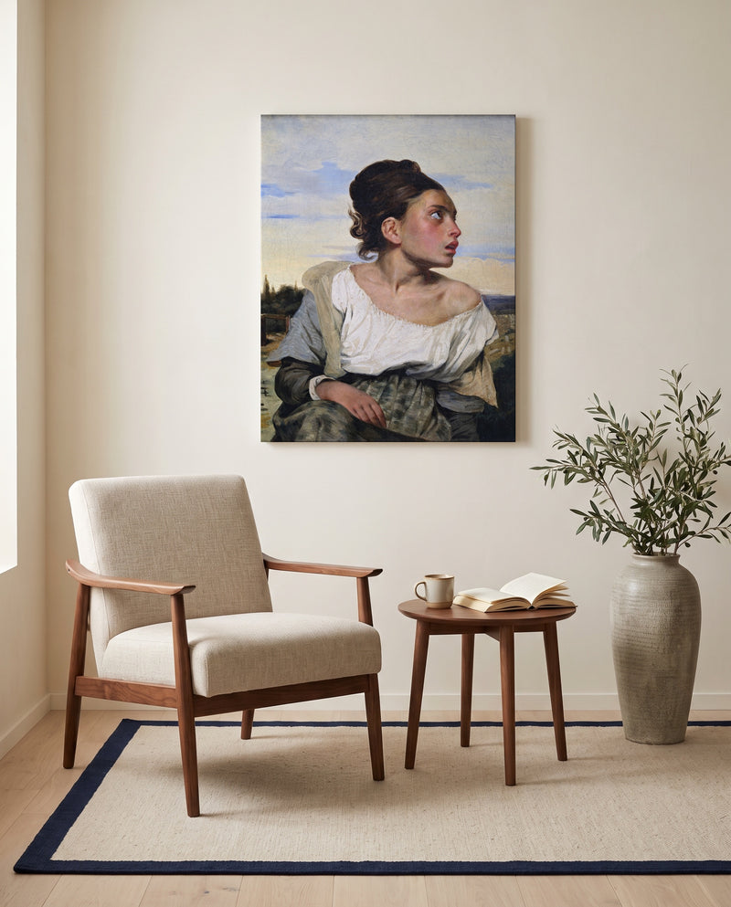 Orphan Girl at the Cemetery by Eugène Delacroix as a stretched canvas above a linen lounge chair in a reading corner
