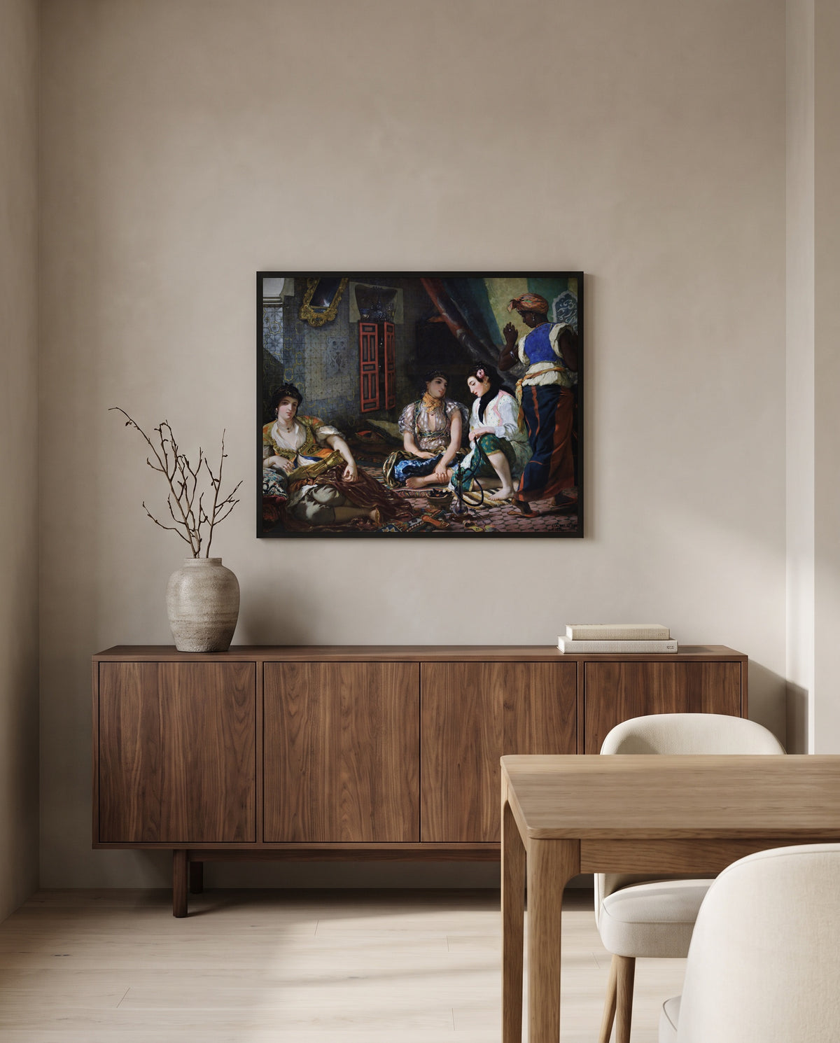 Women of Algiers by Eugène Delacroix in a black frame above a walnut sideboard in a dining room