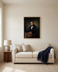 Alessandro Manzoni by Francesco Hayez framed in natural oak above a cream sofa in a warm living room