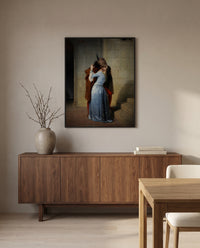 The Kiss by Francesco Hayez in a black frame above a walnut sideboard in a dining room