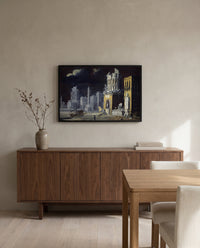 Fantastic Ruins by François de Nomé in a black frame above a walnut sideboard in a dining room