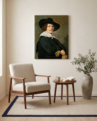 Portrait of a Young Man by Frans Hals as a stretched canvas above a linen lounge chair in a reading corner
