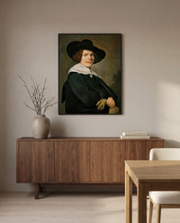 Portrait of a Young Man by Frans Hals in a black frame above a walnut sideboard in a dining room