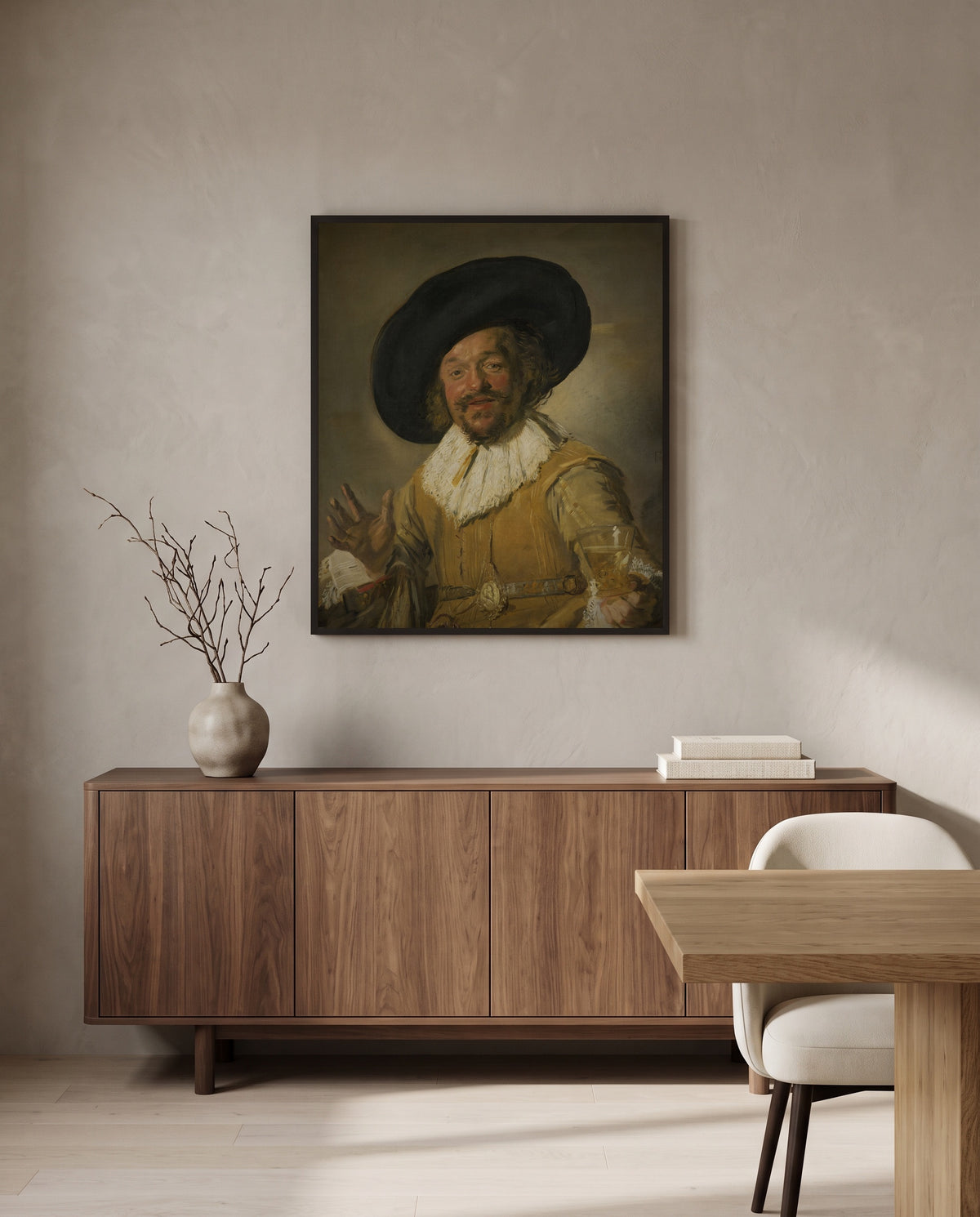 The Merry Drinker by Frans Hals in a black frame above a walnut sideboard in a dining room
