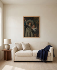Young Man and Woman by Frans Hals framed in natural oak above a cream sofa in a warm living room