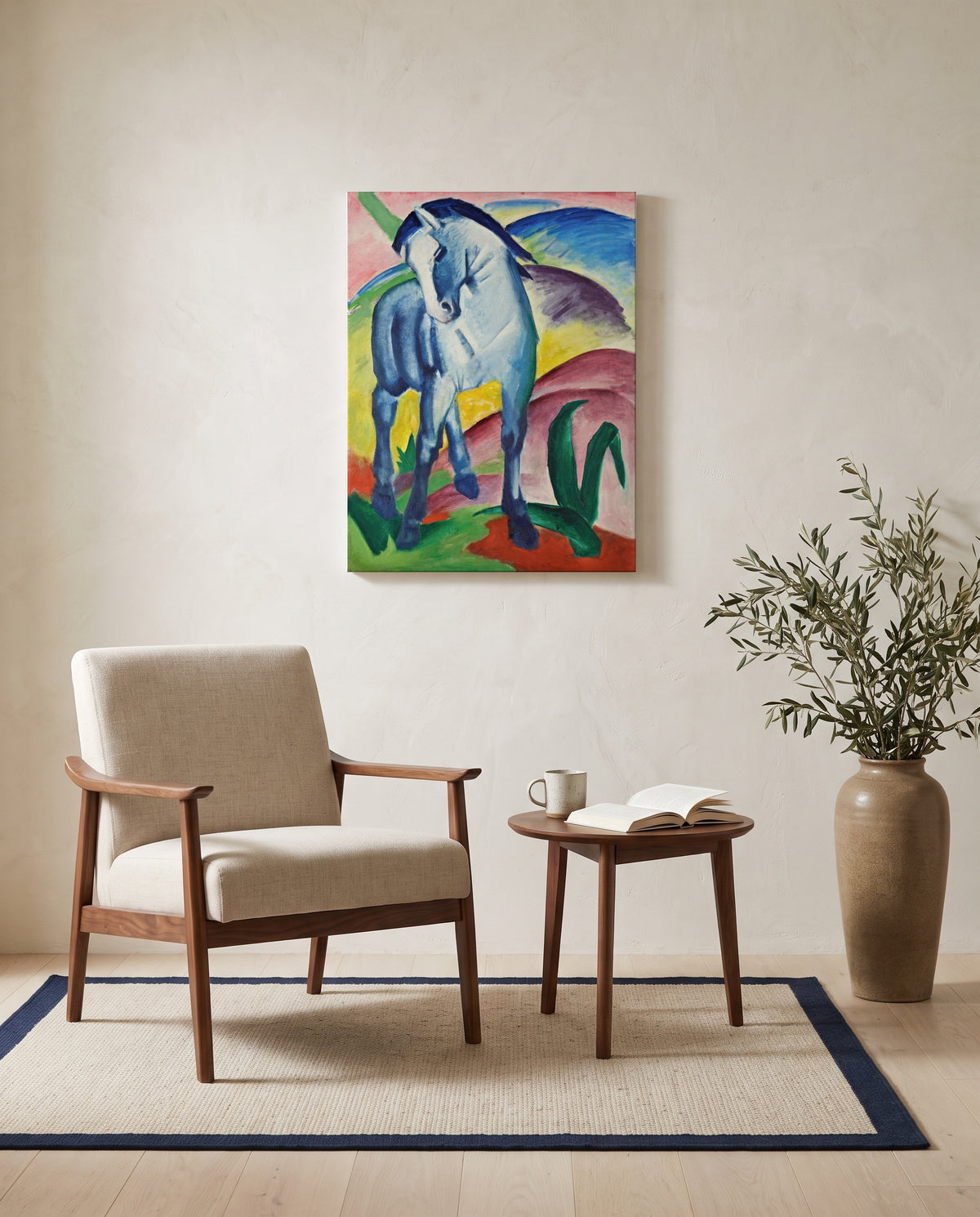 Blue Horse I by Franz Marc as a stretched canvas above a linen lounge chair in a reading corner