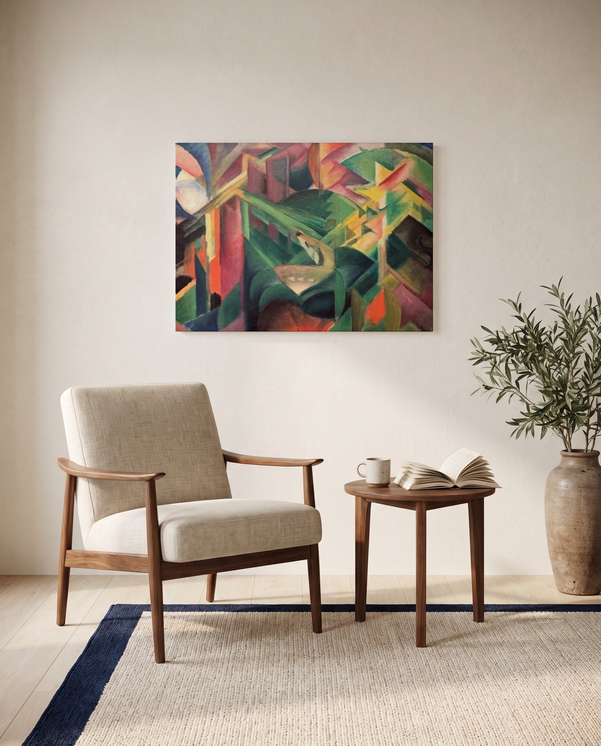 Deer in a Monastery Garden by Franz Marc as a stretched canvas above a linen lounge chair in a reading corner
