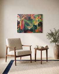 Deer in a Monastery Garden by Franz Marc as a stretched canvas above a linen lounge chair in a reading corner