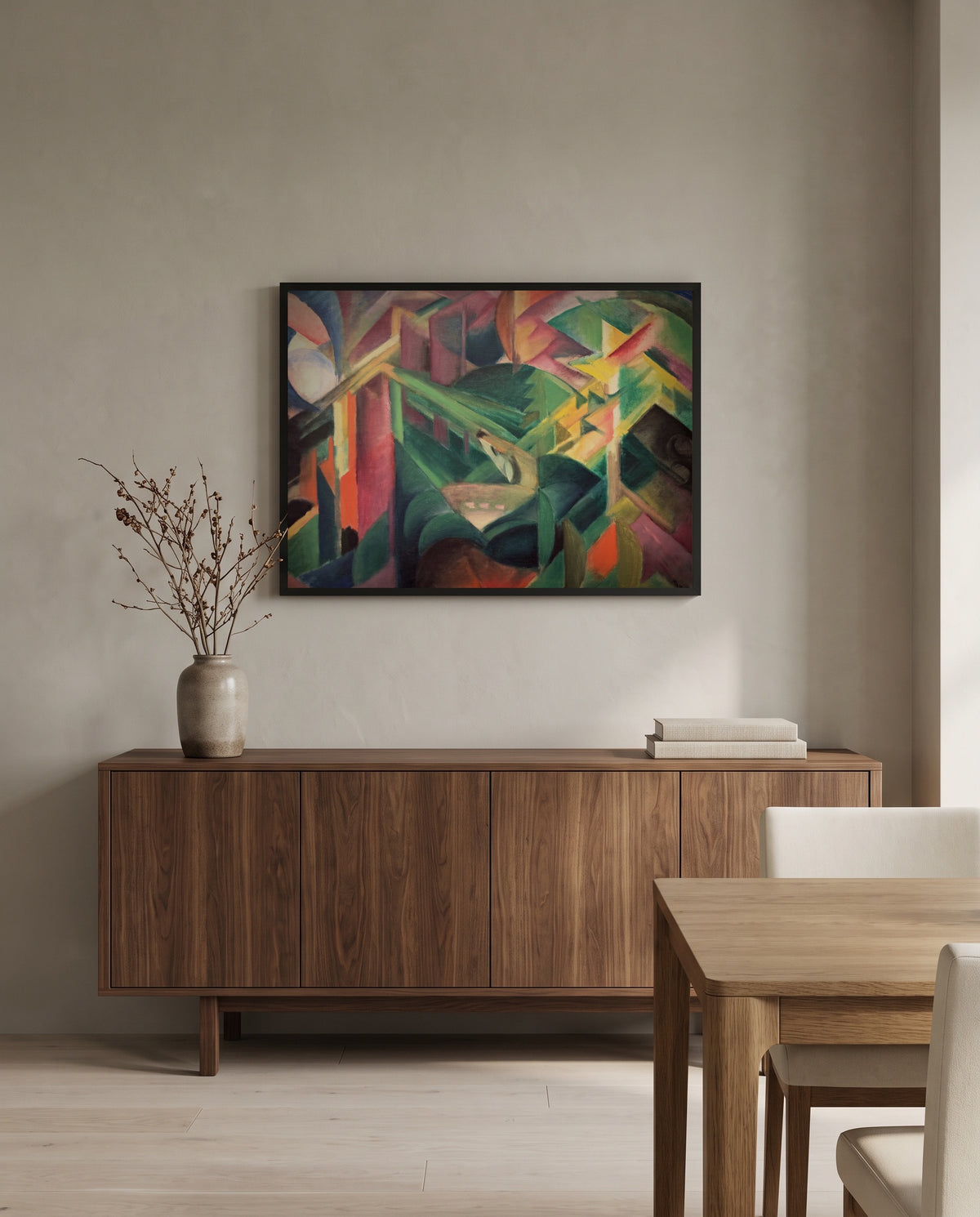 Deer in a Monastery Garden by Franz Marc in a black frame above a walnut sideboard in a dining room