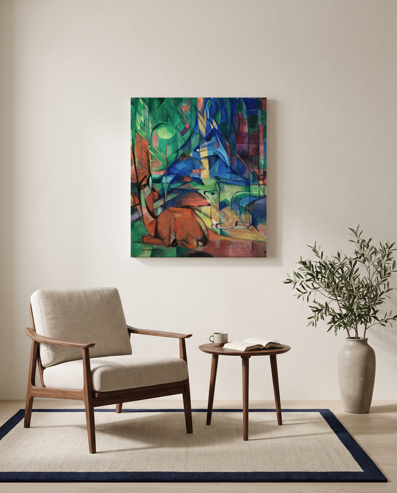 Deer in the Forest II by Franz Marc as a stretched canvas above a linen lounge chair in a reading corner