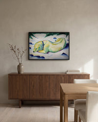 Dog Lying in the Snow by Franz Marc in a black frame above a walnut sideboard in a dining room