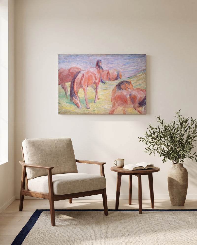 Grazing Horses I by Franz Marc as a stretched canvas above a linen lounge chair in a reading corner